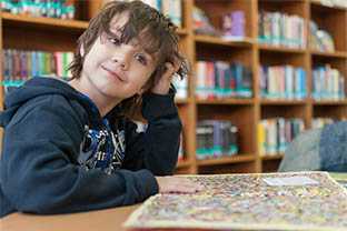 A photo of student in a library.